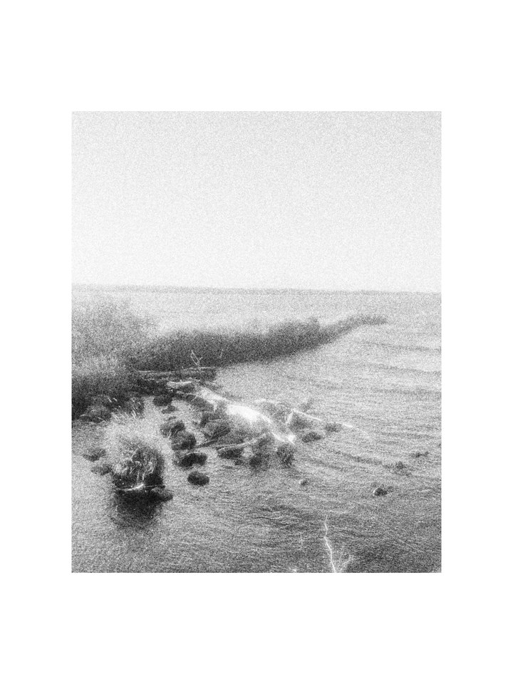 A rippling sea and a rocky shore